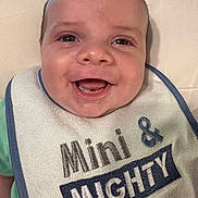 Cooper joined the competition — help win amazing prizes! baby, infant, smiling, face, bib, clothing, happy, young_child, cute, portrait, child, skin, mouth, eyes, person, apparel, closeup, baby_bib, joy, baby_face