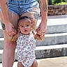 Willow joined the competition — help win amazing prizes! toddler, baby, child, person, standing, holding_hands, romper, floral, tattoos, adult, legs, colorful_footwear, crocs, outdoor, steps, water_feature, sunlight, skin, summer, cute