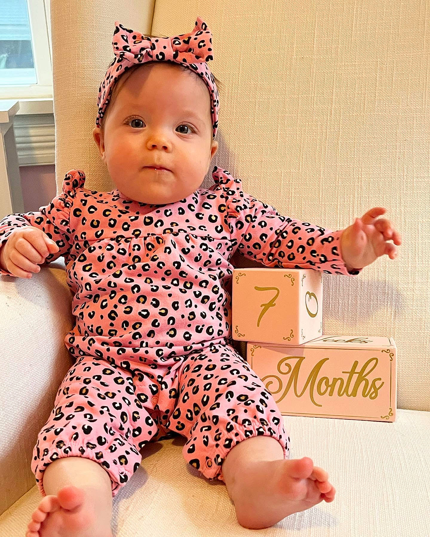 Eliza joined the competition — help win amazing prizes! baby, baby_toddler_clothing, cheek, child, finger, foot, gesture, happy, human_leg, nail, neck, orange, pattern, person, photograph, pink, skin, sleeve, thigh, thumb