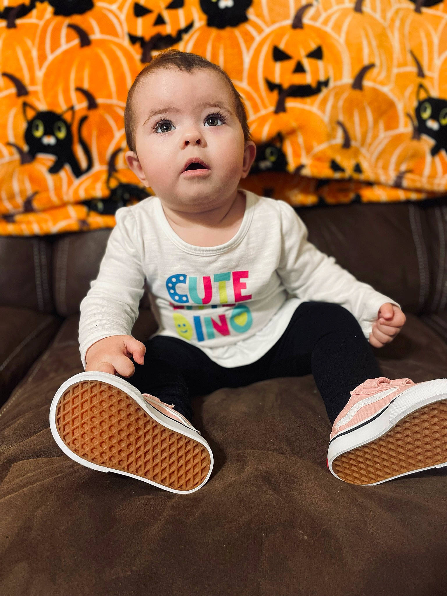 Natalynn joined the competition — help win amazing prizes! baby, baby_toddler_clothing, child, comfort, flooring, fun, hairstyle, happy, leisure, mammal, orange, person, product, shoe, sitting, sleeve, sneakers, sports_equipment, surprise, t_shirt