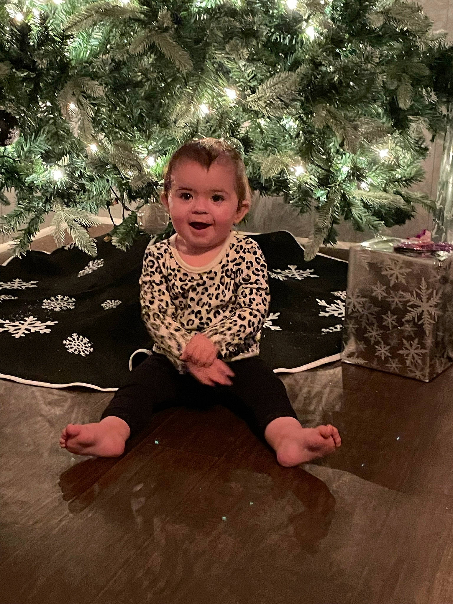 Natalynn joined the competition — help win amazing prizes! barefoot, child, christmas_decoration, christmas_ornament, event, flash_photography, flooring, foot, fun, happy, holiday, joy, leisure, person, plant, sitting, smile, standing, tints_and_shades, toddler
