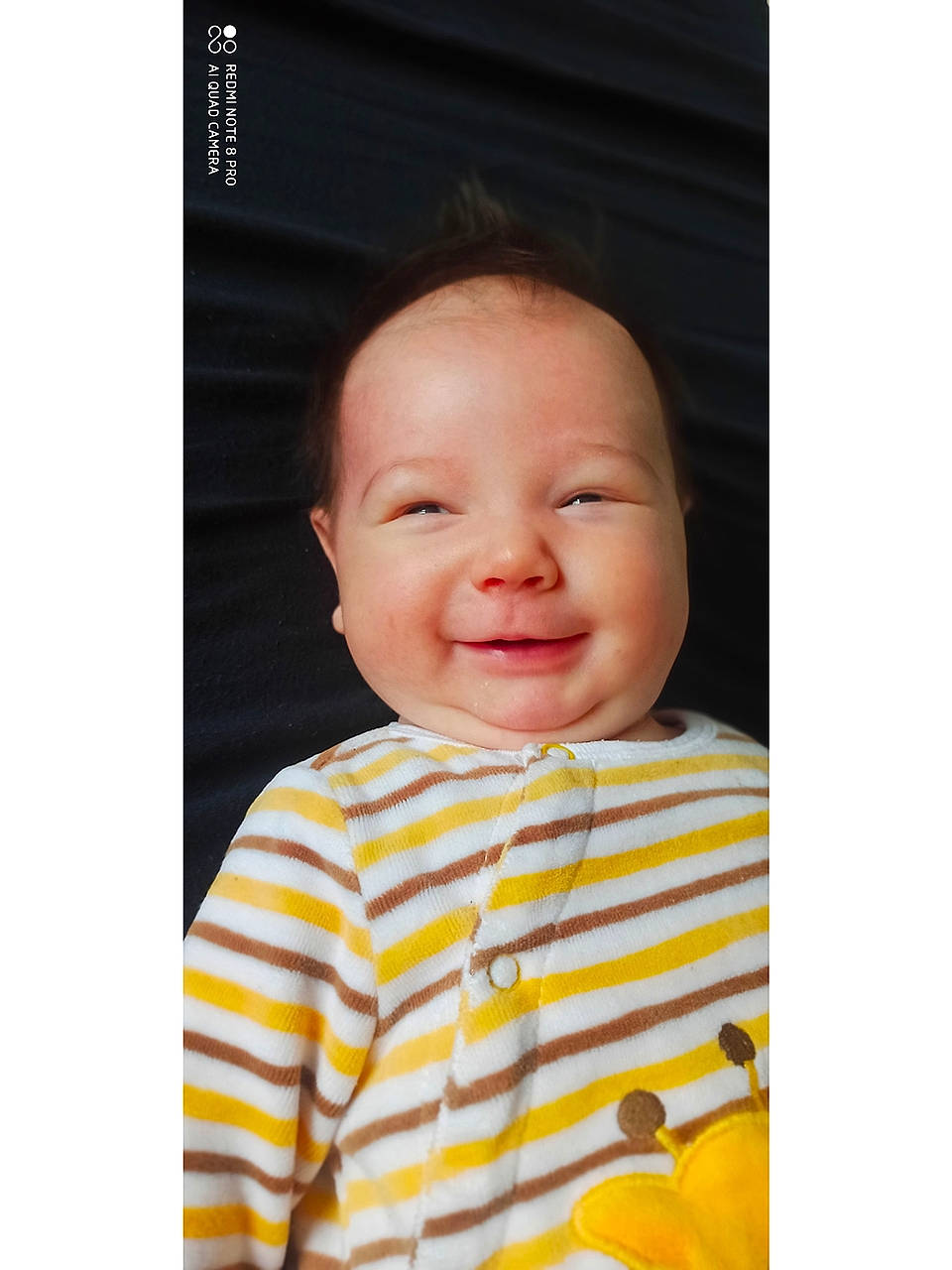 Emily a rejoint le concours — aidez-le/la à gagner de superbes lots ! baby, baby_toddler_clothing, cheek, child, chin, comfort, eyebrow, face, fun, happy, head, joy, linens, magenta, nose, outerwear, pattern, person, sleeve, smile