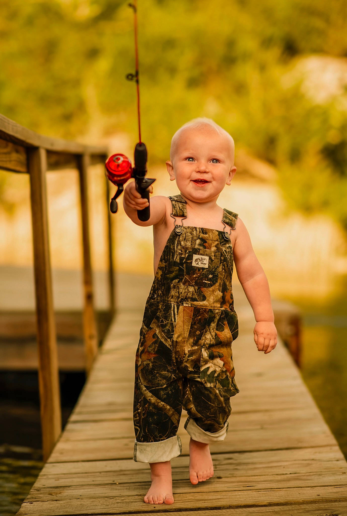 Gavin is registered to the contest to win money with this photo: baby, baby_toddler_clothing, barefoot, child, day_dress, dress, flash_photography, fun, grass, happy, joy, leisure, pattern, people_in_nature, person, plant, recreation, skin, standing, toddler