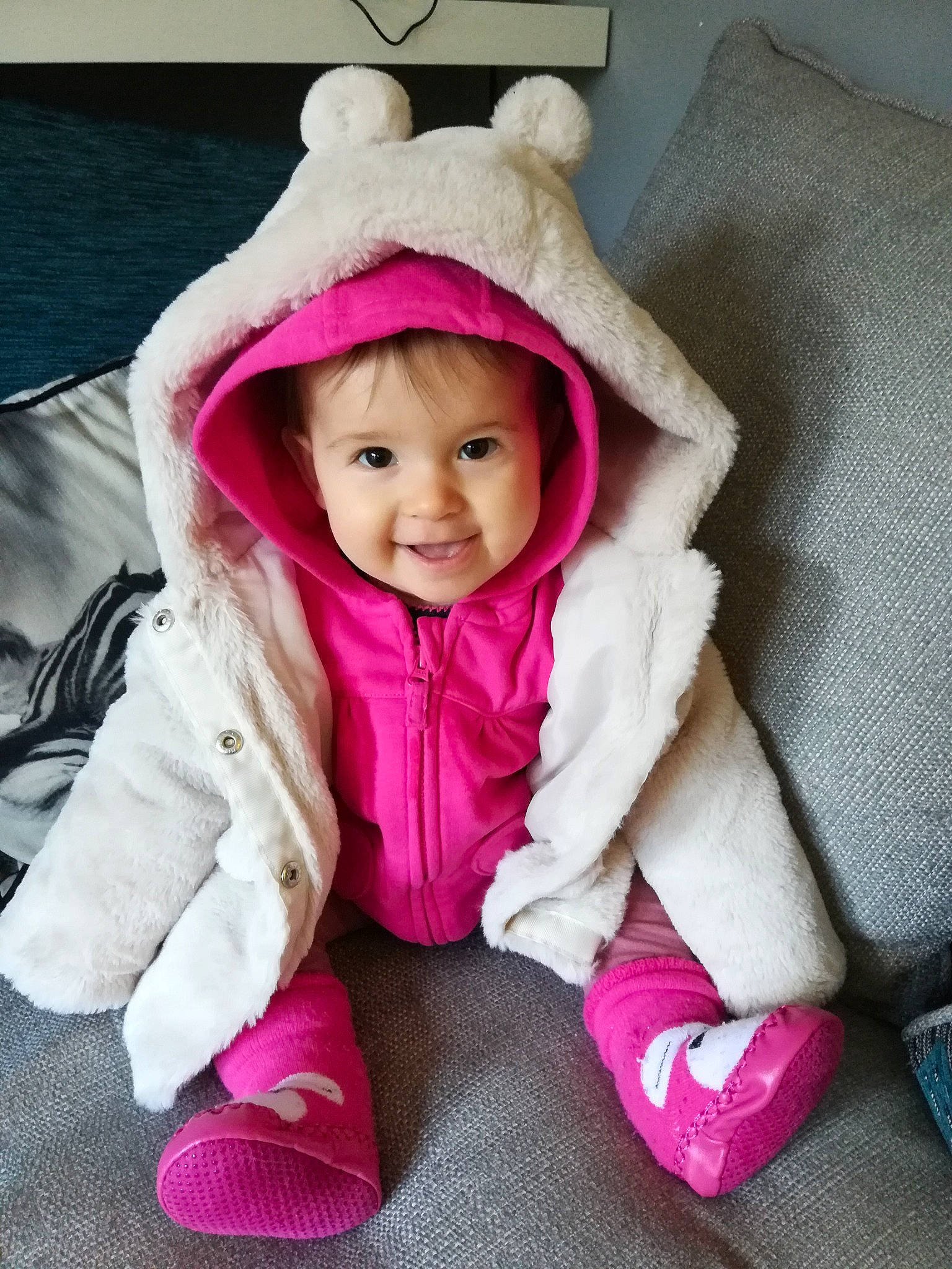 Amilia is registered to the contest to win money with this photo: baby, cheek, child, ear, head, headgear, joy, outerwear, person, pink, play, product, skin, smile, toddler