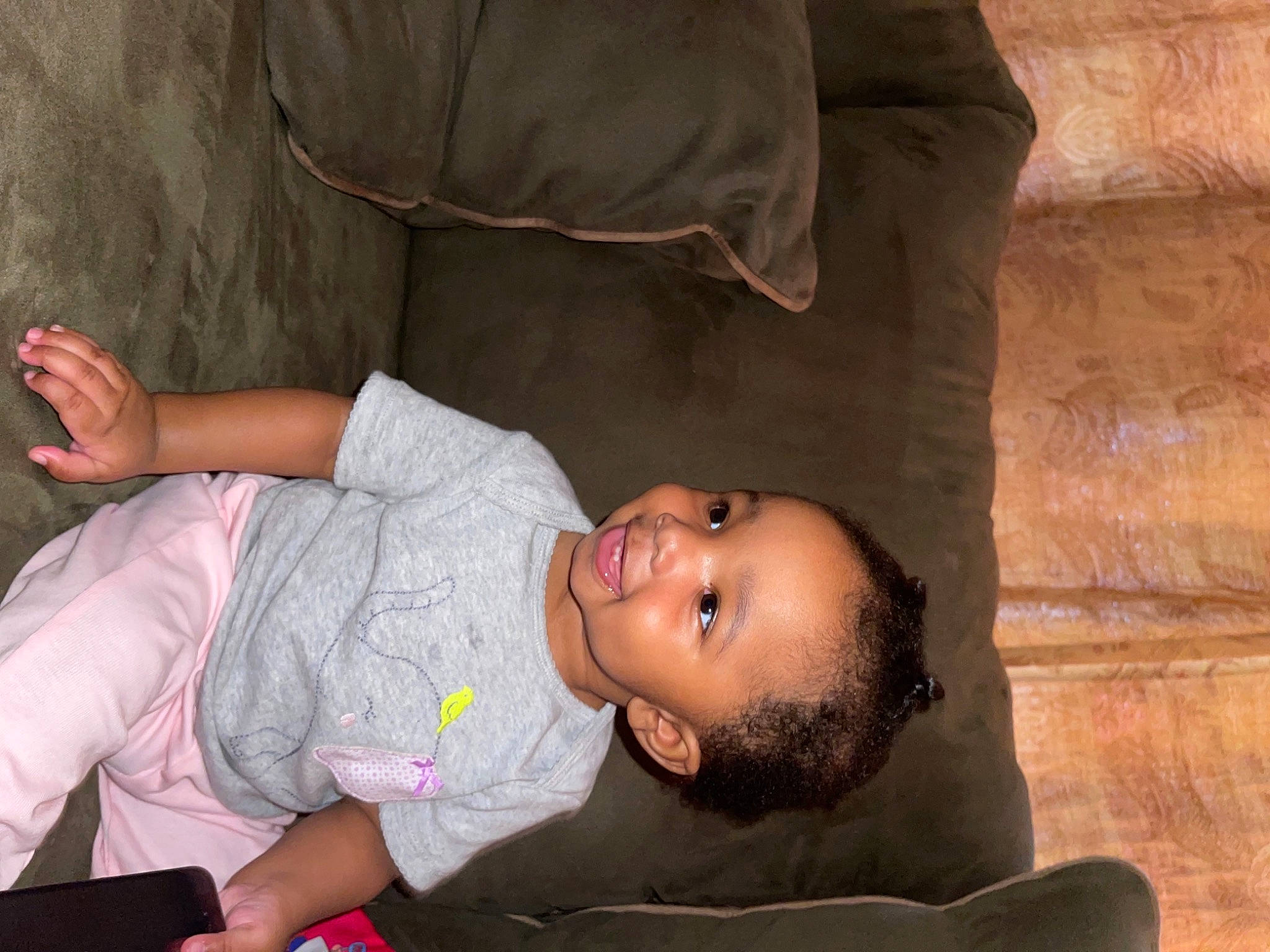 Anyla is registered to the contest to win money with this photo: abdomen, baby_products, cheek, child, comfort, couch, eye, flash_photography, flooring, fun, happy, joint, joy, mouth, person, room, sitting, skin, smile, t_shirt