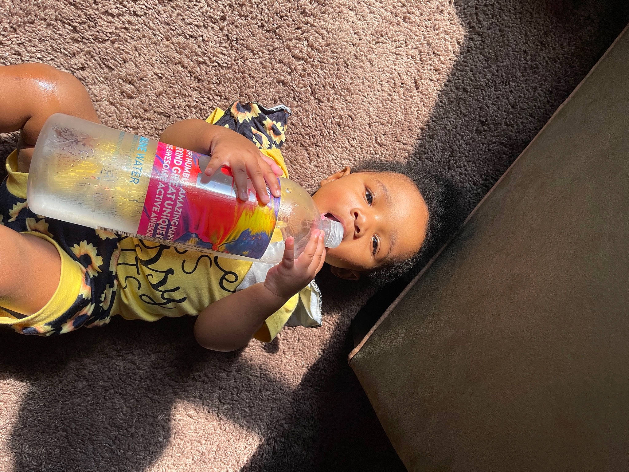 Anyla joined the competition — help win amazing prizes! aluminum_can, arm, baby, bottle, child, drink, drinkware, flooring, hand, happy, human_body, human_leg, leg, nail, person, plastic_bottle, skin, thigh, toddler, toy