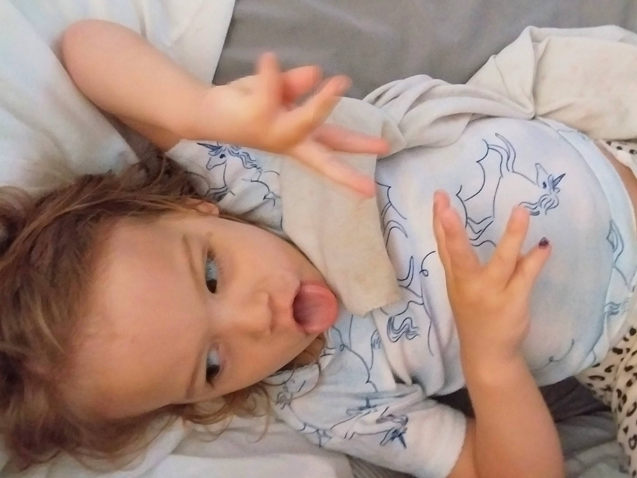 Sophie is registered to the contest to win money with this photo: abdomen, bed, cheek, chest, child, comfort, couch, elbow, eyelash, finger, hand, head, joint, linens, mouth, neck, nose, person, skin, textile