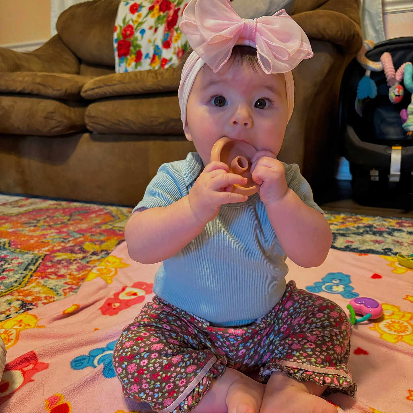 Rosalie is registered to the contest to win money with this photo: architecture, baby, bodypart, building, couch, cushion, face, finger, food, furniture, hand, head, homedecor, indoors, livingroom, person, photography, portrait, room, sitting