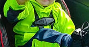 James is registered to the contest to win money with this photo: bright_clothing, car_interior, car_seat, casual_wear, child, curly_hair, daylight, footwear, happy, navy_blue, neon_green, portrait, safety, seatbelt, smiling, toddler, travel, waving_hand, window, young_child