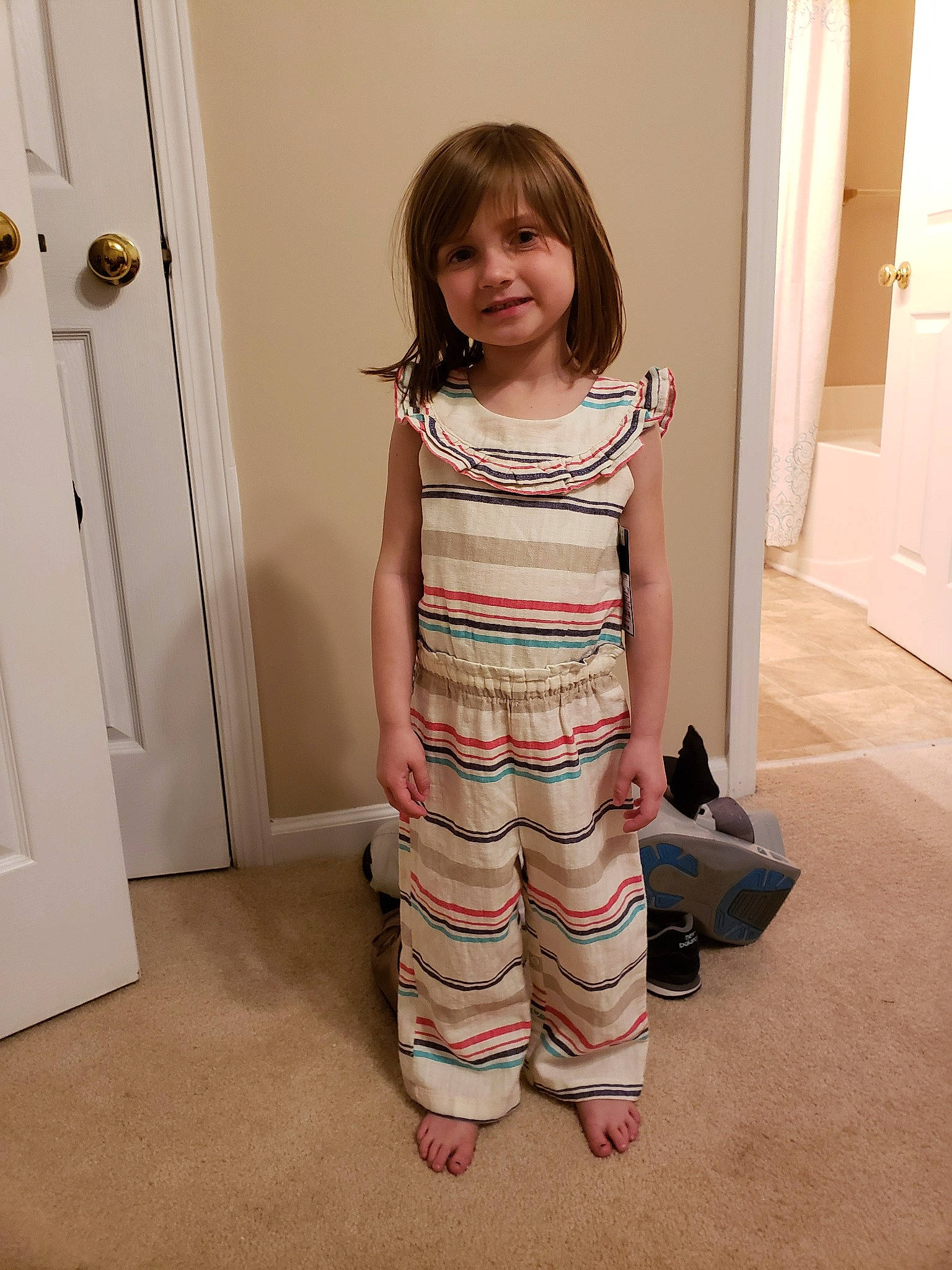 Larkin is registered to the contest to win money with this photo: beige, child, clothing, dress, joint, joy, khaki, knee, leg, leggings, overall, pajamas, pattern, person, shoe, shoulder, skin, sleeve, standing, t_shirt