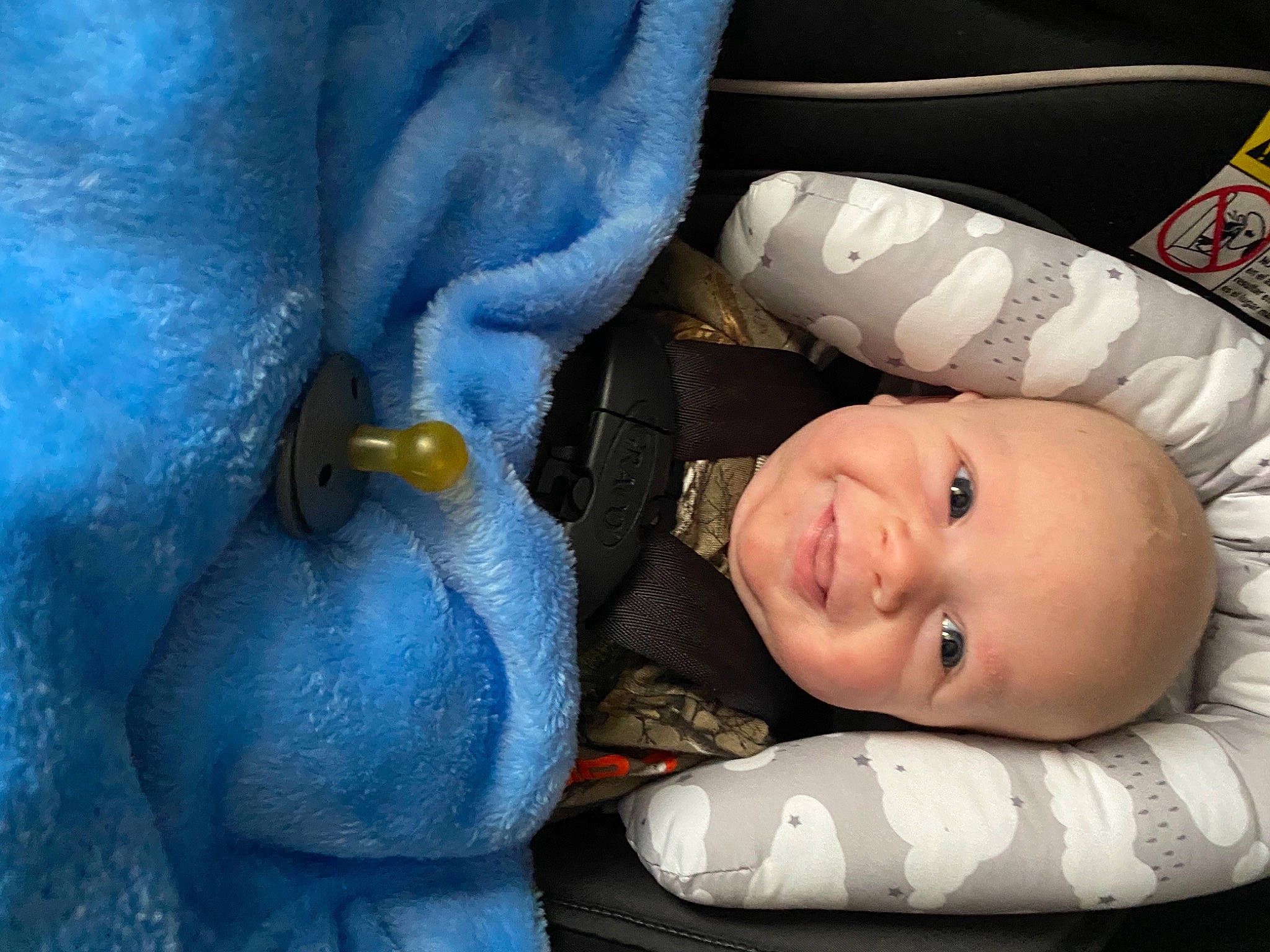 Cory is registered to the contest to win money with this photo: baby, baby_toddler_clothing, cheek, child, comfort, finger, gesture, hand, head, human_body, lip, mammal, mouth, nose, person, skin, smile, textile, toddler, vertebrate