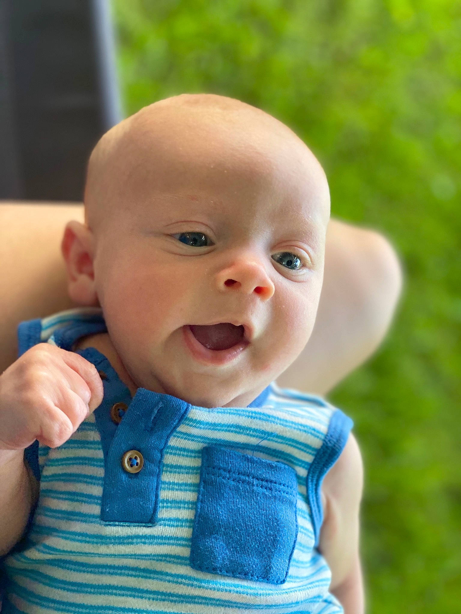 Cory is registered to the contest to win money with this photo: azure, baby, baby_toddler_clothing, cheek, child, collar, electric_blue, eye, fun, gesture, grass, happy, iris, lip, nose, pattern, person, skin, sleeve, smile