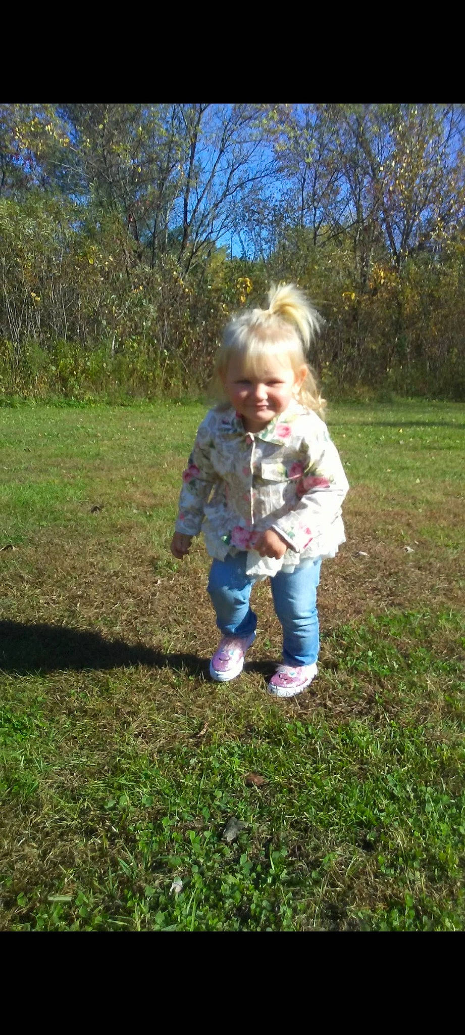 Blaire joined the competition — help win amazing prizes! baby, baby_toddler_clothing, child, denim, fun, garden, grass, grassland, happy, jeans, joy, lawn, people_in_nature, person, plant, sitting, sky, sleeve, smile, soil