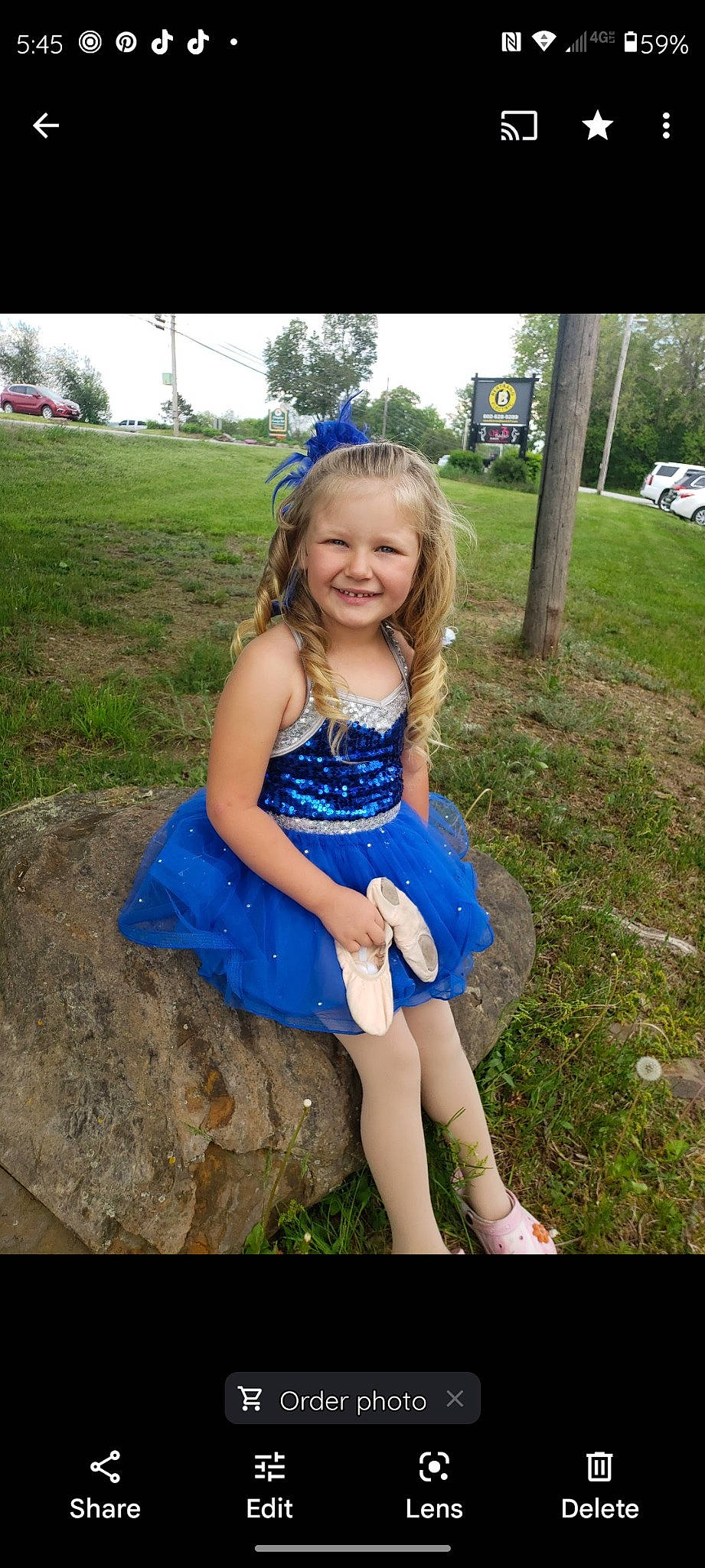 Blaire is registered to the contest to win money with this photo: blond, dress, electric_blue, flash_photography, fun, grass, grassland, happy, human_leg, iris, joy, leisure, meadow, nature, people_in_nature, person, plant, smile, summer, thigh