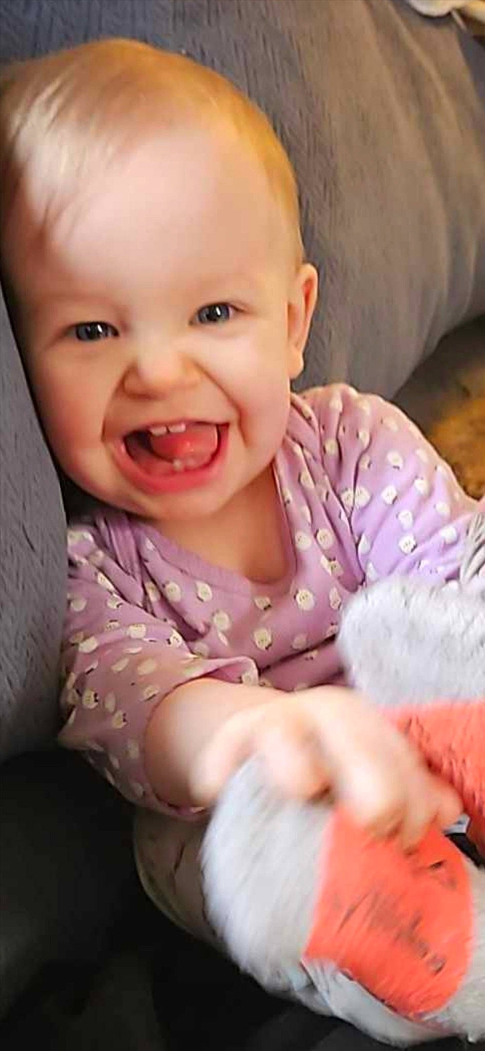 Amelia is registered to the contest to win money with this photo: baby, baby_toddler_clothing, cheek, child, comfort, ear, eyebrow, finger, gesture, happy, iris, lip, mouth, neck, nose, person, pink, skin, sleeve, smile