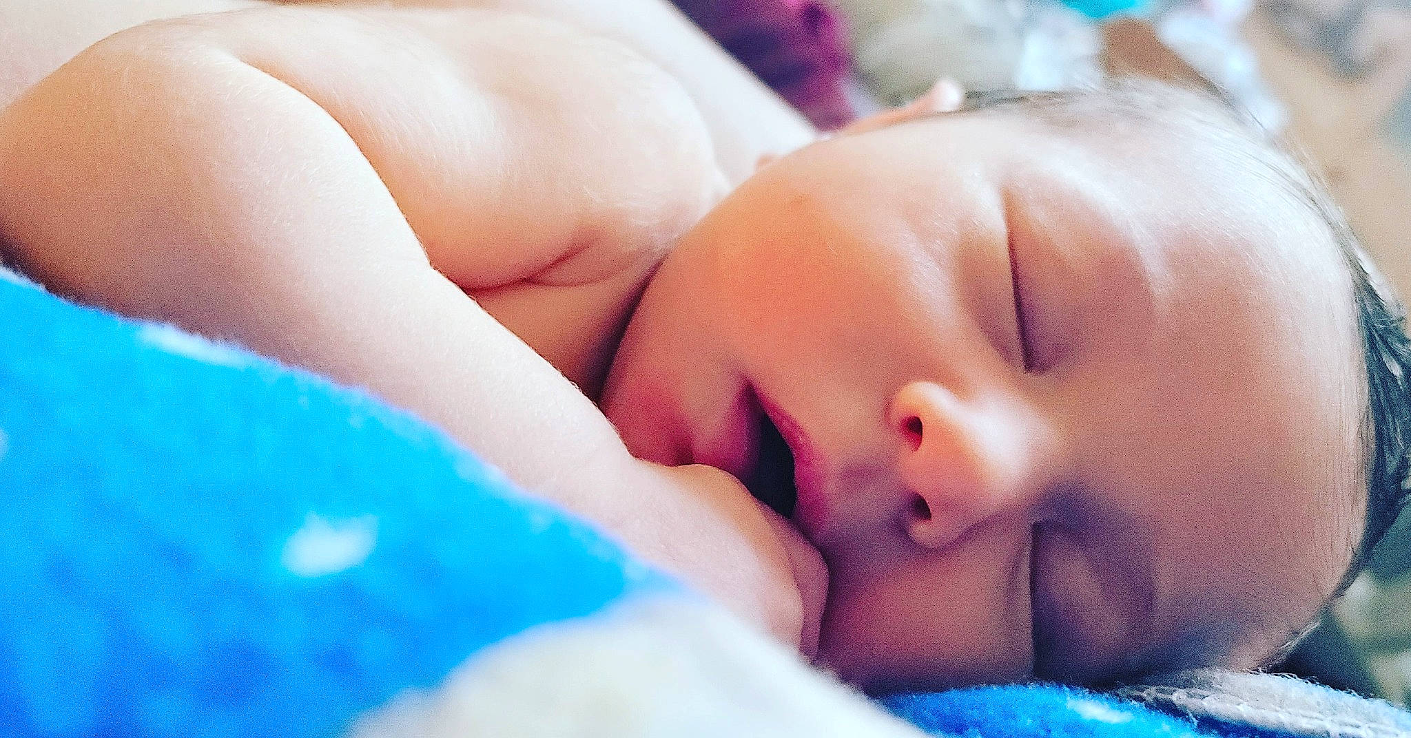 Wyatt is registered to the contest to win money with this photo: baby, baby_sleeping, blue, cheek, child, close_up, comfort, electric_blue, eyelash, finger, gesture, happy, human_leg, lip, mouth, nail, nose, person, skin, thumb