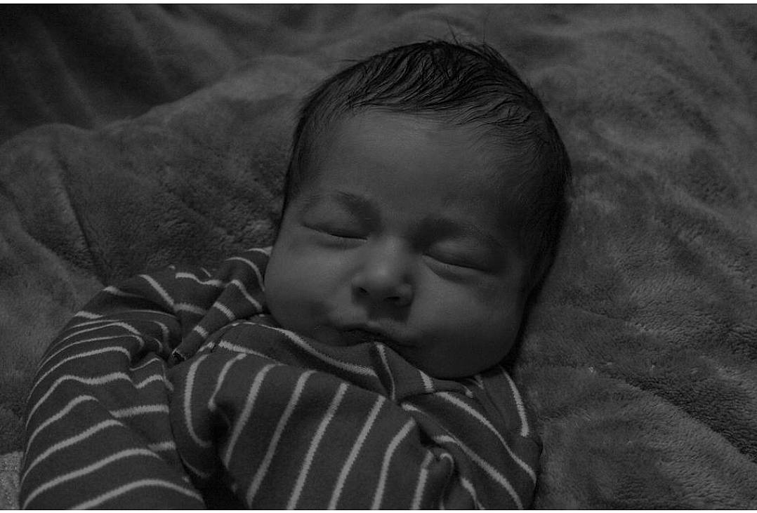 Wyatt is registered to the contest to win money with this photo: baby, bedtime, cheek, child, comfort, darkness, eye, eyebrow, flash_photography, grass, grey, happy, linens, monochrome, monochrome_photography, nap, nose, person, room, textile