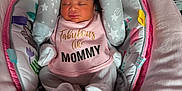 Zailani joined the competition — help win amazing prizes! baby, newborn, sleeping, onesie, pink, baby_seat, plush_toy, elephant_toy, deer_toy, blanket, patterned_blanket, cozy, infant, cute, soft_toys, child, indoors, resting, portrait, clothing