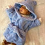 baby, sleeping, blue_robe, hippo_hood, blanket, soft_texture, cute, infant, cozy, child, sleep, warm_clothing, footwear, indoors, resting, adorable, toddler, face, hooded_clothing, plush