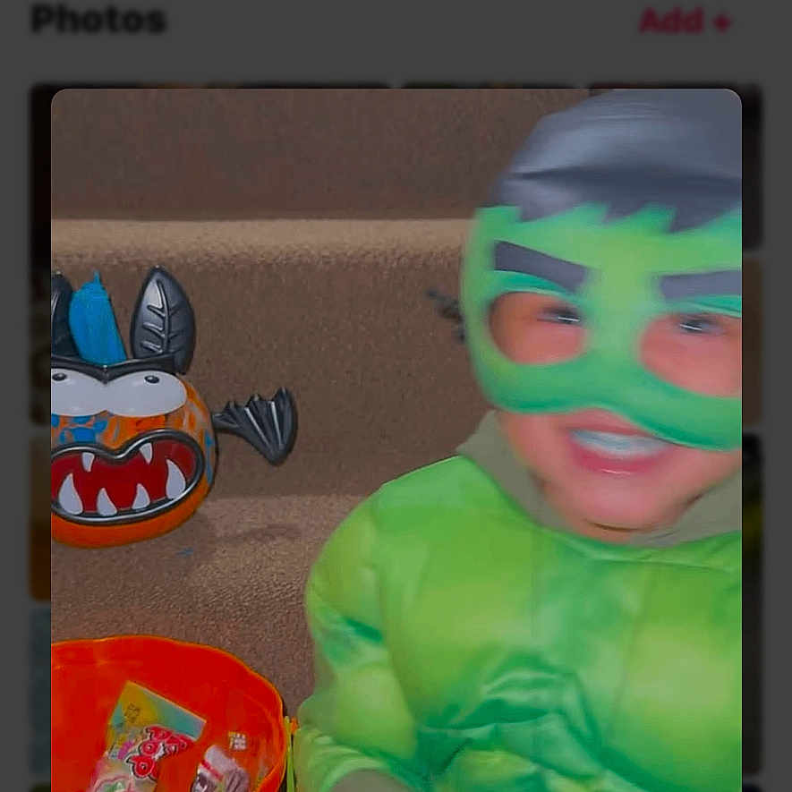 Nazier is registered to the contest to win money with this photo: blur, bucket, candy, carpet, child, costume, decoration, face, fun, green, halloween, holiday, indoor, kid, mask, play, pumpkin, smile, stairs, toy