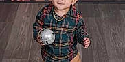 Nazier is registered to the contest to win money with this photo: child, christmas, cute, decorations, festive, flooring, holiday_decor, indoor, jingle_bell, person, plaid_shirt, portrait, smiling, standing, tan_pants, toddler, toy, white_shoes, wrapped_gifts, young_child