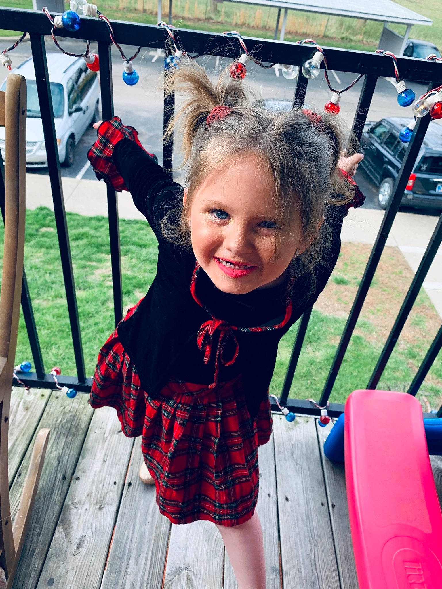 Ember is registered to the contest to win money with this photo: child, city, electric_blue, event, facial_expression, fun, grass, hairstyle, happy, joy, leisure, magenta, pattern, person, plant, recreation, smile, swing, textile, toddler