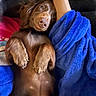 puppy, dog, brown_fur, long_ears, lying_down, upside_down, paws, belly, blanket, blue_blanket, couch, indoor, cozy, relaxed, cute, pet, animal, portrait, close_up, photography