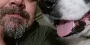 Cocoa is registered to the contest to win money with this photo: animal, beard, casual, closeup, clothing, cozy, dog, face, friendship, furry, happy, head, indoors, man, pet, portrait, selfie, smile, tongue, warm