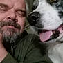 animal, beard, casual, closeup, clothing, cozy, dog, face, friendship, furry, happy, head, indoors, man, pet, portrait, selfie, smile, tongue, warm