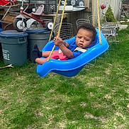 Jayden joined the competition — help win amazing prizes! toddler, child, swing, blue, outdoor, grass, playground, backyard, toy, tricycle, rope, chair, metal_chair, plastic, garden, person, expression, daylight, casual, young_child