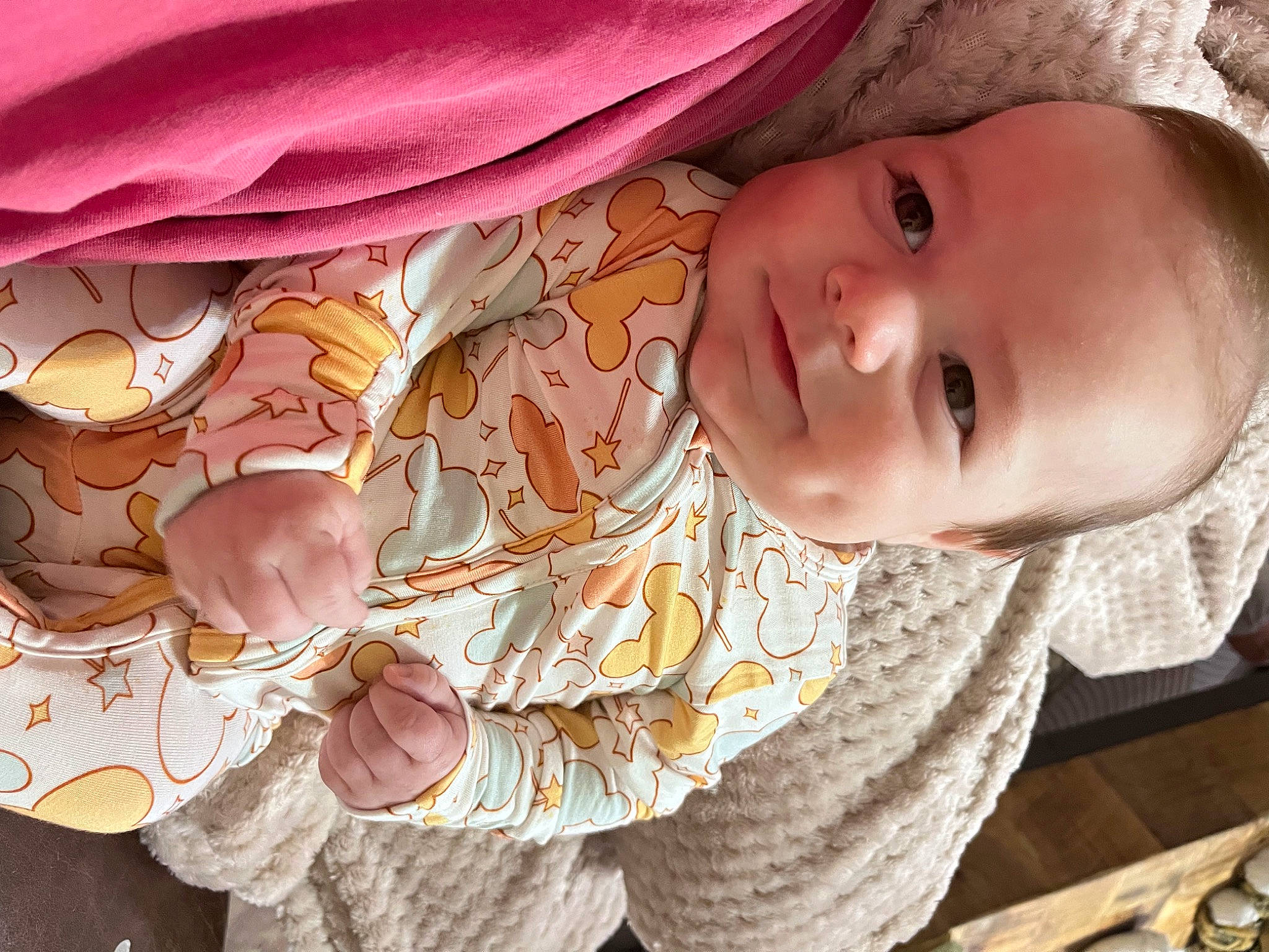 Rhodes is registered to the contest to win money with this photo: baby, baby_toddler_clothing, cheek, child, eyelash, happy, human, human_body, iris, lip, mouth, nose, pattern, person, pink, skin, sleeve, smile, textile, toddler