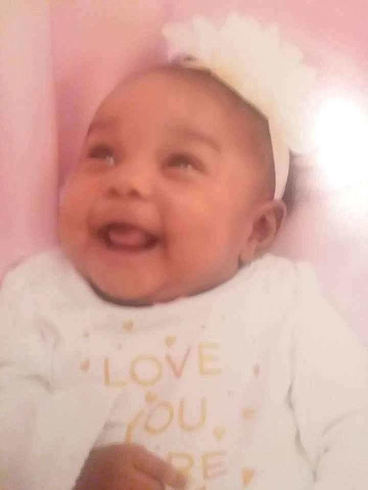 Kaydence is registered to the contest to win money with this photo: cheek, child, chin, close_up, day, eyebrow, face, facial_expression, forehead, head, human_hair_color, infant, lip, nose, person, pink, product, skin, smile, toddler