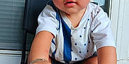 Josiah joined the competition — help win amazing prizes! baby, child, sitting, shoes, feet, hand, bracelet, shirt, stars, chair, indoor, window, screen, curious, expression, portrait, young, person, footwear, casual