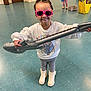 Amber Rae is registered to the contest to win money with this photo: accessories, boy, child, clothing, face, female, footwear, girl, glasses, head, male, performer, person, photography, portrait, racket, shoe, soloperformance, sunglasses, t_shirt