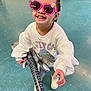 Amber Rae joined the competition — help win amazing prizes! accessories, baby, clothing, face, footwear, guitar, guitarist, head, leisureactivities, music, musicalinstrument, musician, performer, person, photography, portrait, shoe, sitting, soloperformance, sunglasses