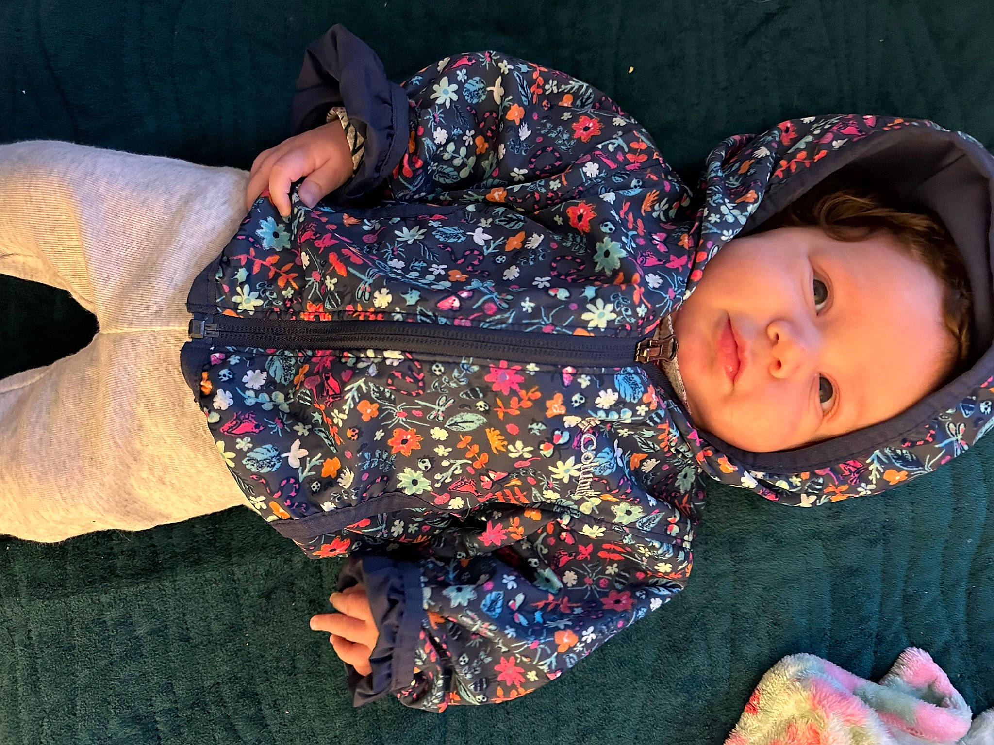 Khelani is registered to the contest to win money with this photo: baby, baby_toddler_clothing, child, comfort, fashion_accessory, fun, human_body, human_leg, lap, linens, pattern, person, sitting, sleeve, textile, thigh, toddler, woolen