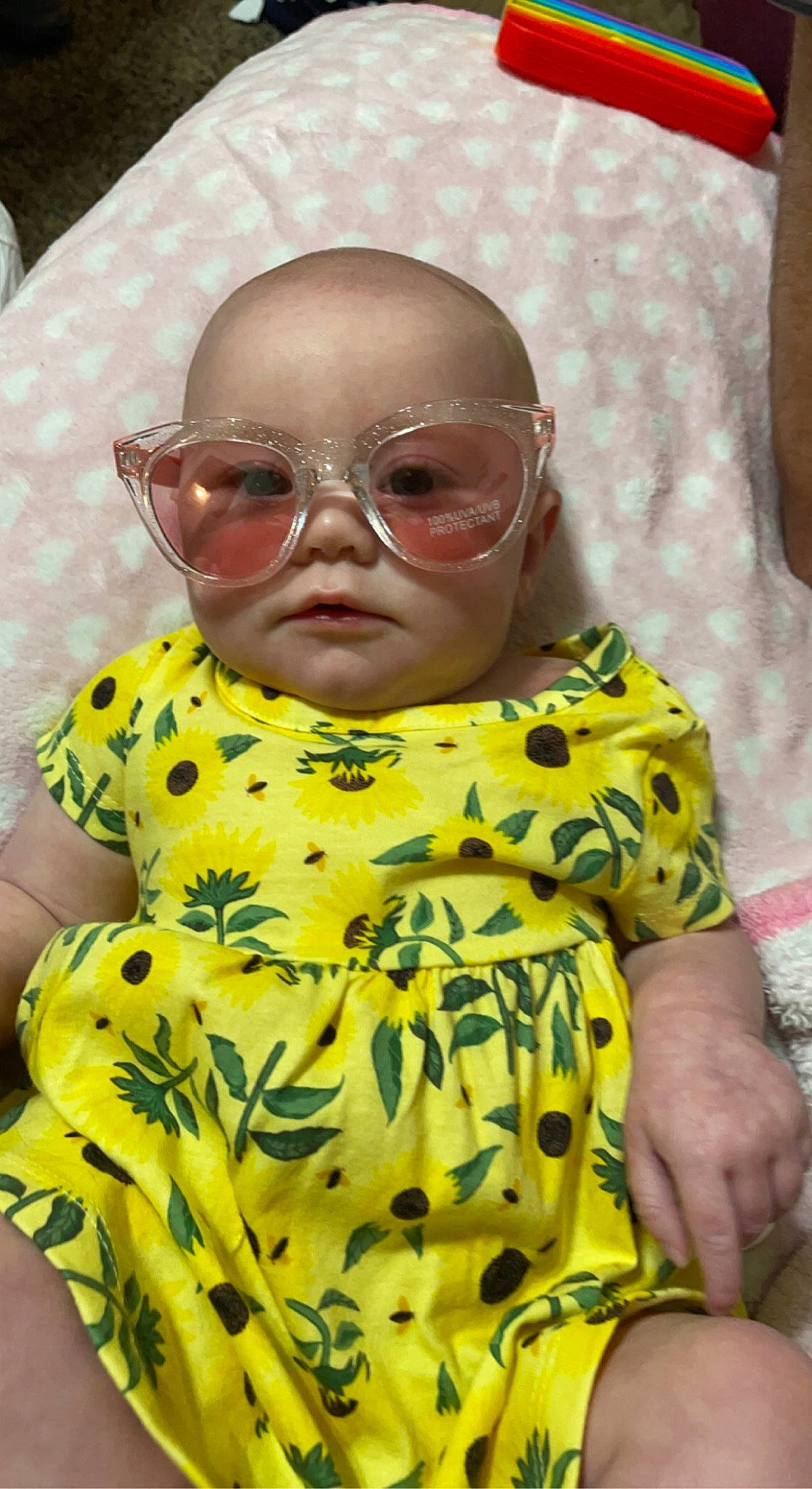 Raylynn joined the competition — help win amazing prizes! baby, baby_toddler_clothing, chin, dress, eyewear, glasses, happy, head, mammal, outerwear, person, pink, product, skin, sleeve, sunglasses, textile, toddler, vertebrate, vision_care