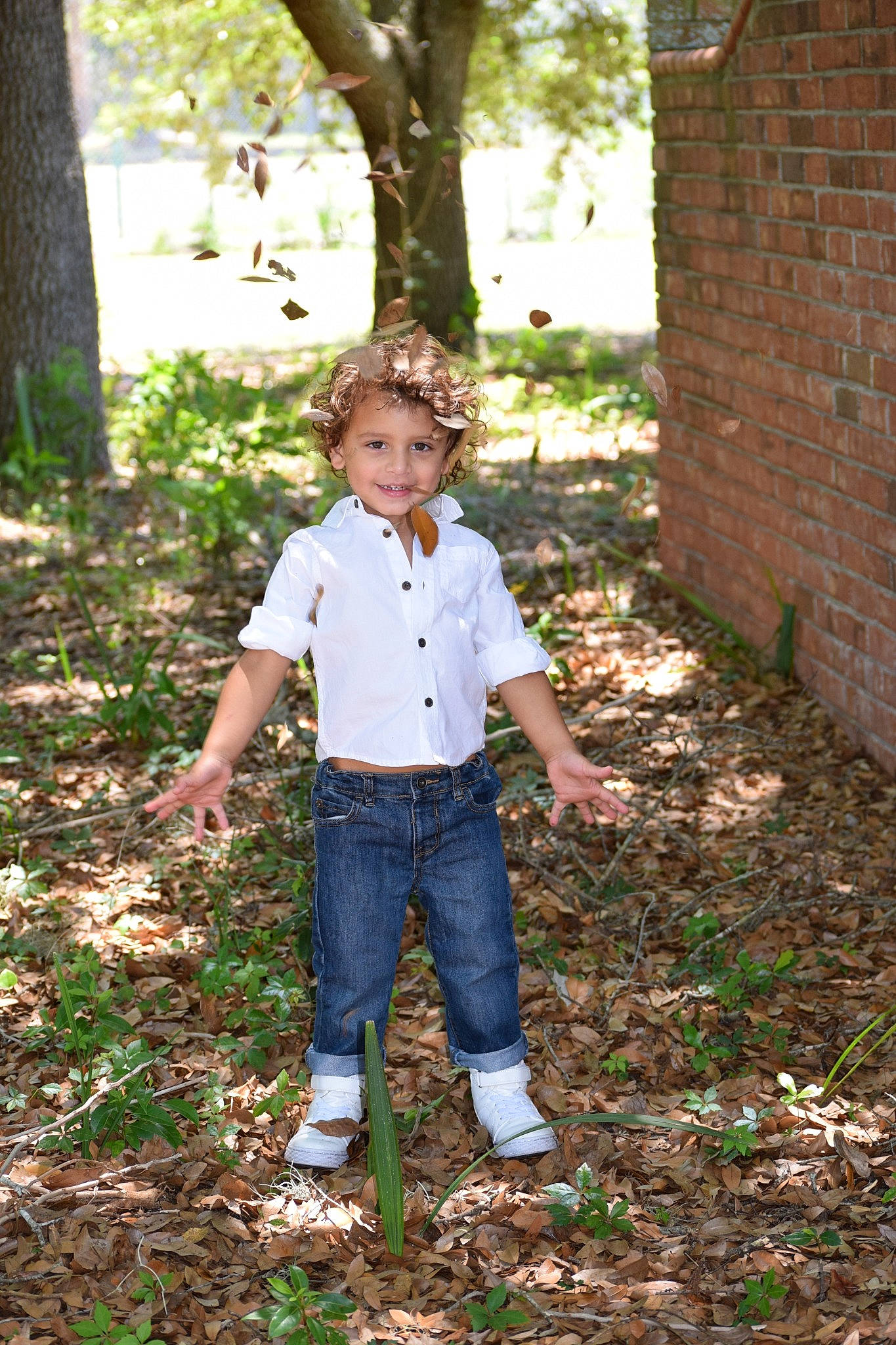 Alijah is registered to the contest to win money with this photo: backyard, child, child_model, denim, fun, grass, green, joy, leaf, male, people_in_nature, person, photograph, photography, plant, portrait, portrait_photography, smile, standing, toddler