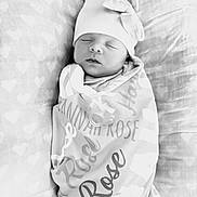 Hannah joined the competition — help win amazing prizes! newborn, baby, sleeping, blanket, hat, pillow, heart_pattern, pacifier, wrapped, infant, cute, peaceful, soft, cozy, portrait, indoors, monochrome, black_and_white, resting, child