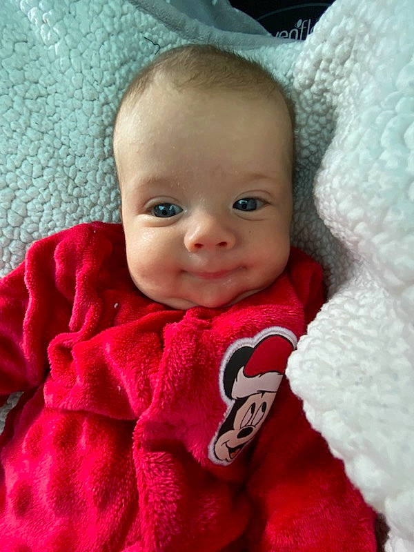 Elijah is registered to the contest to win money with this photo: baby, baby_toddler_clothing, cheek, chin, comfort, eye, eyebrow, eyelash, happy, head, headgear, iris, linens, lip, nose, person, pink, skin, sleeve, smile