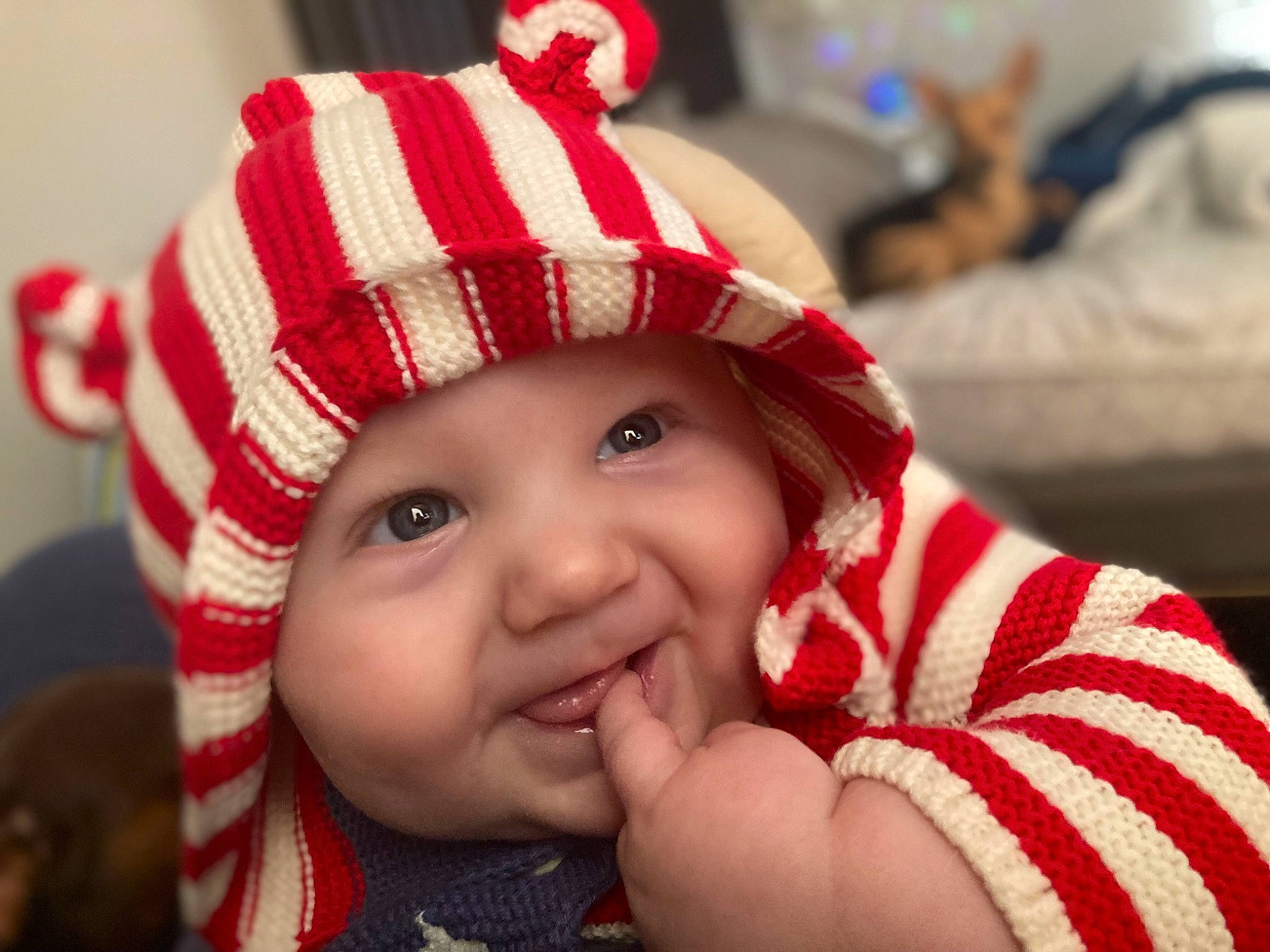 Wyatt is registered to the contest to win money with this photo: baby, cap, cheek, comfort, costume_hat, eye, face, finger, fun, gesture, happy, hat, head, headwear, lip, nose, person, red, skin, smile
