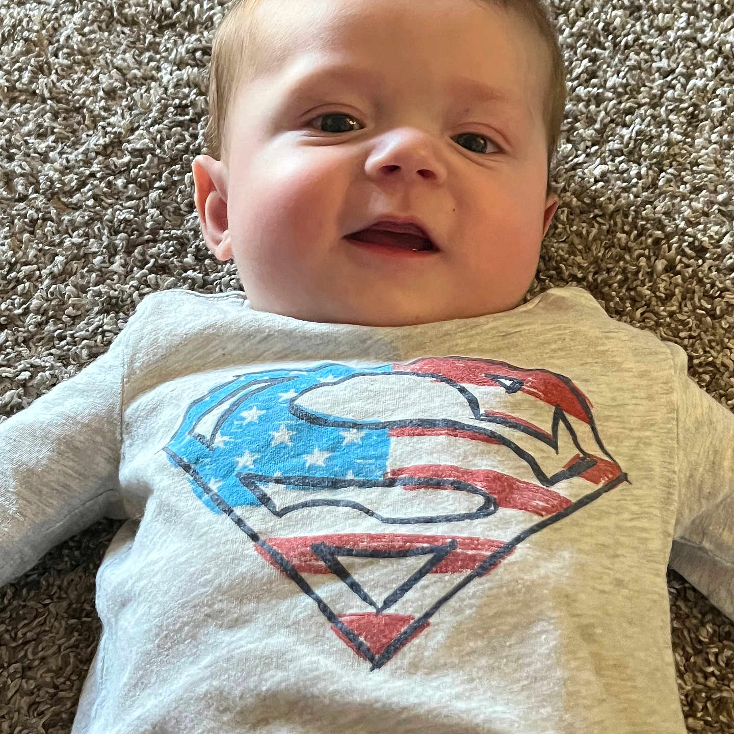 Ezekiel is registered to the contest to win money with this photo: applique, baby, blanket, clothing, cushion, face, happy, head, homedecor, longsleeve, pants, pattern, person, photography, portrait, quilt, shirt, sleeve, symbol, t_shirt