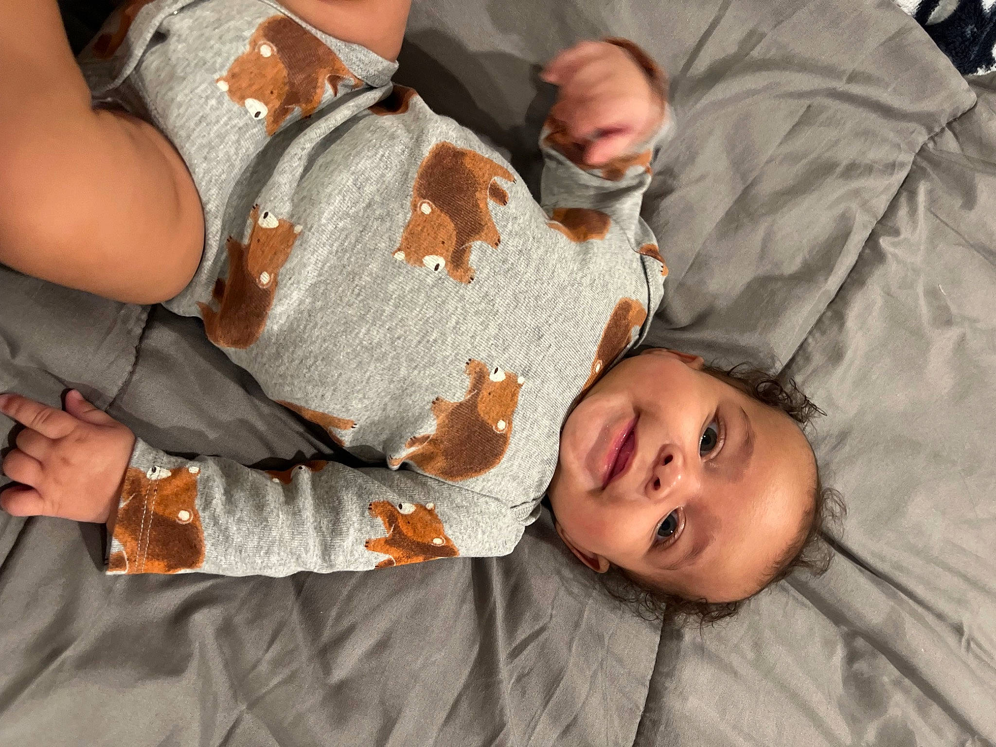 Jayvion is registered to the contest to win money with this photo: baby, baby_toddler_clothing, bracelet, child, comfort, event, fun, gesture, grass, happy, jewellery, mammal, pattern, person, sitting, smile, toddler, tree, vacation, wood