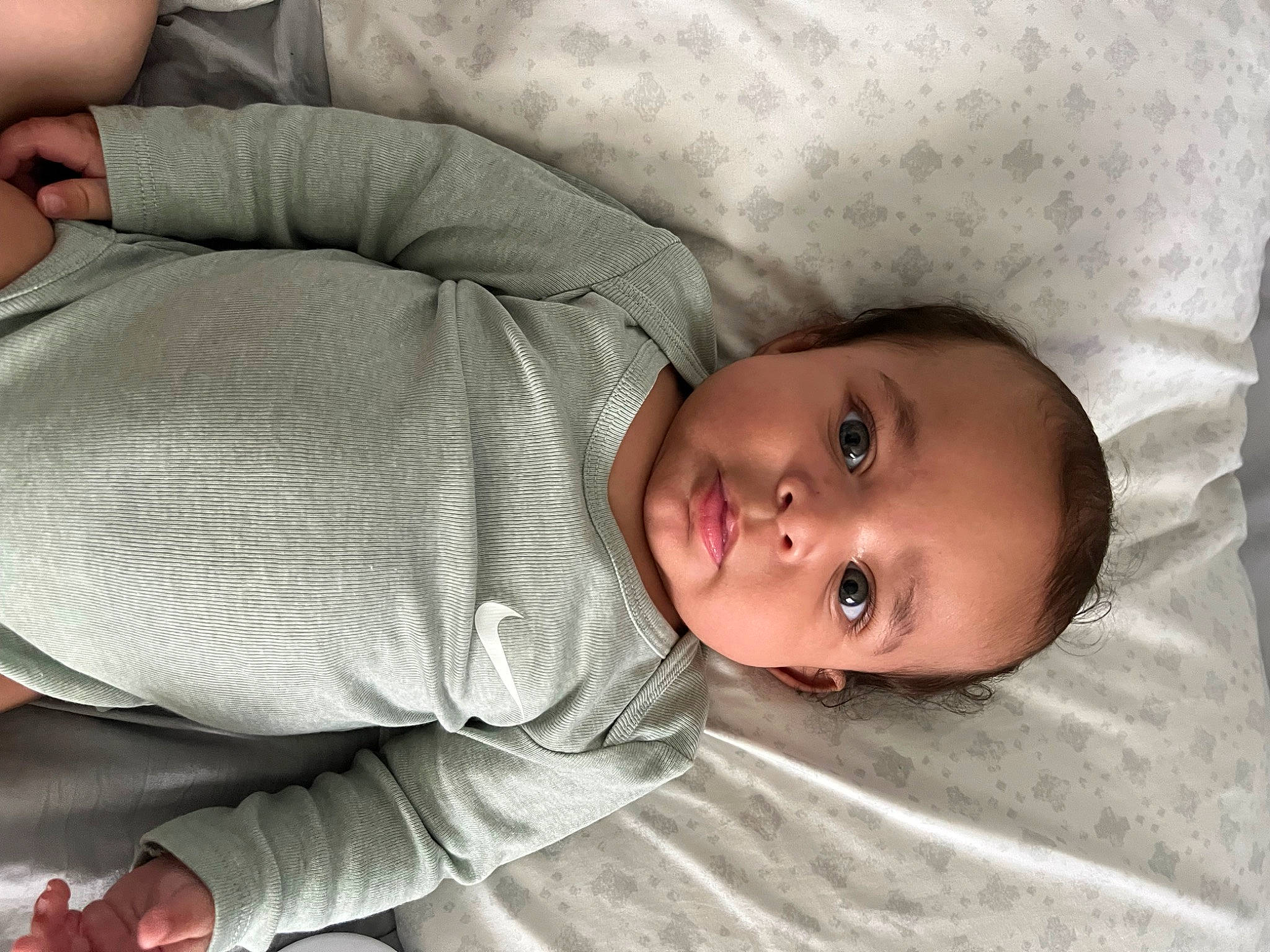 Jayvion is registered to the contest to win money with this photo: baby, baby_products, baby_toddler_clothing, bedtime, cheek, child, comfort, finger, flooring, hand, linens, mammal, mouth, nose, person, skin, sleeve, textile, thumb, toddler
