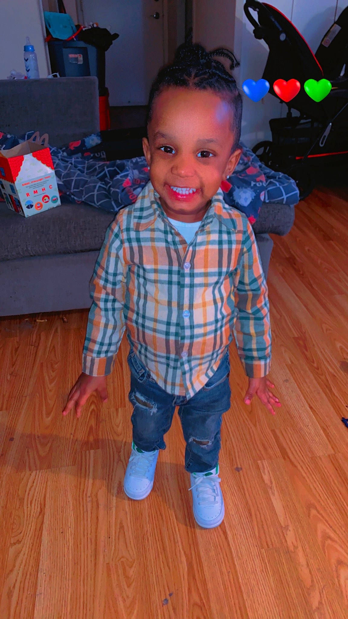 Emon Rockett joined the competition — help win amazing prizes! baby_toddler_clothing, cheek, face, floor, flooring, fun, hair, hairstyle, hardwood, head, joy, person, plaid, skin, sleeve, smile, t_shirt, toddler, varnish, white