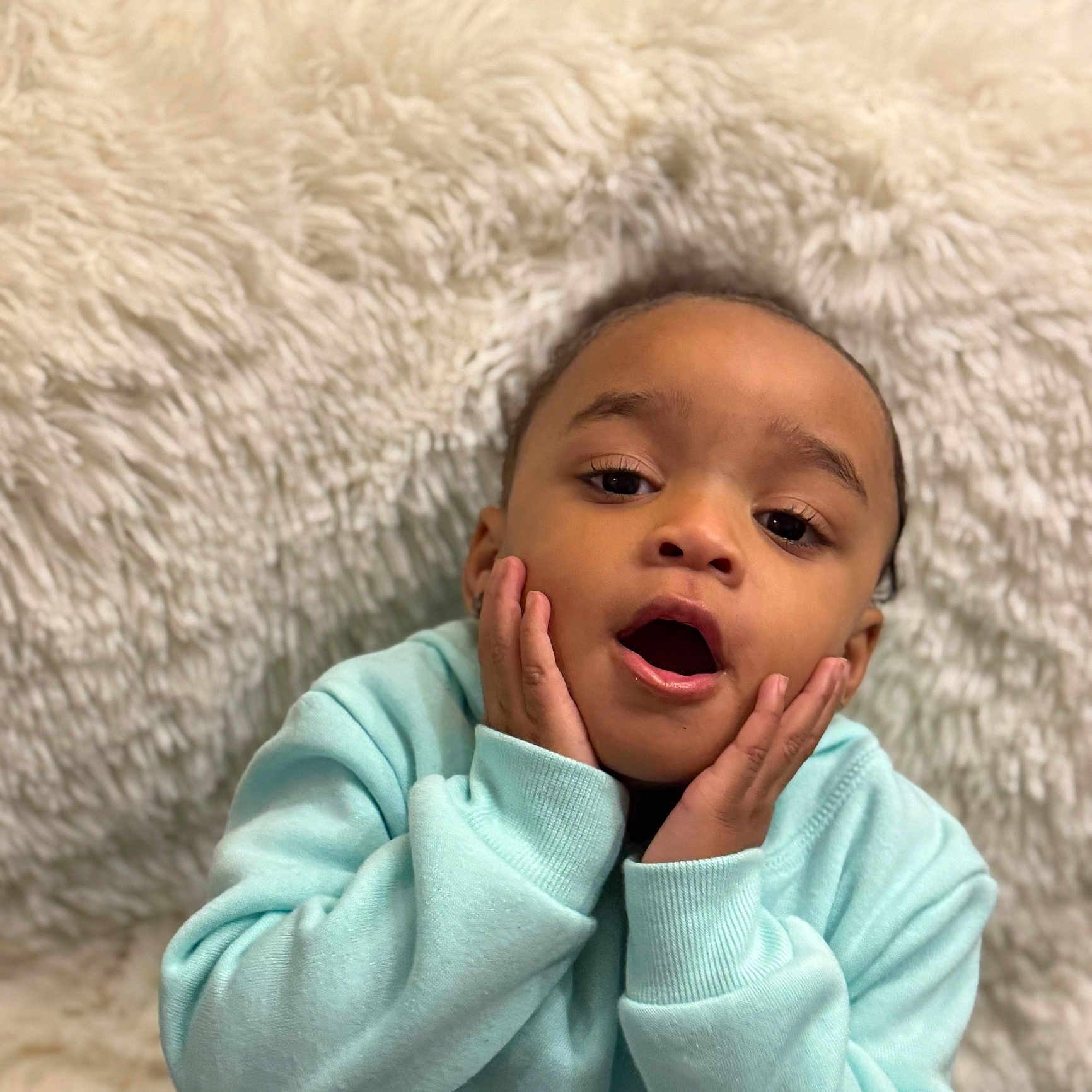 Jayla joined the competition — help win amazing prizes! baby, clothing, coat, face, head, person, surprised, yawning