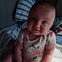 Aero joined the competition — help win amazing prizes! baby, bed, blanket, child, cozy, curious, cute, face, floral, hands, indoors, infant, onesie, person, pillow, seated, skin, smile, soft_lighting, young