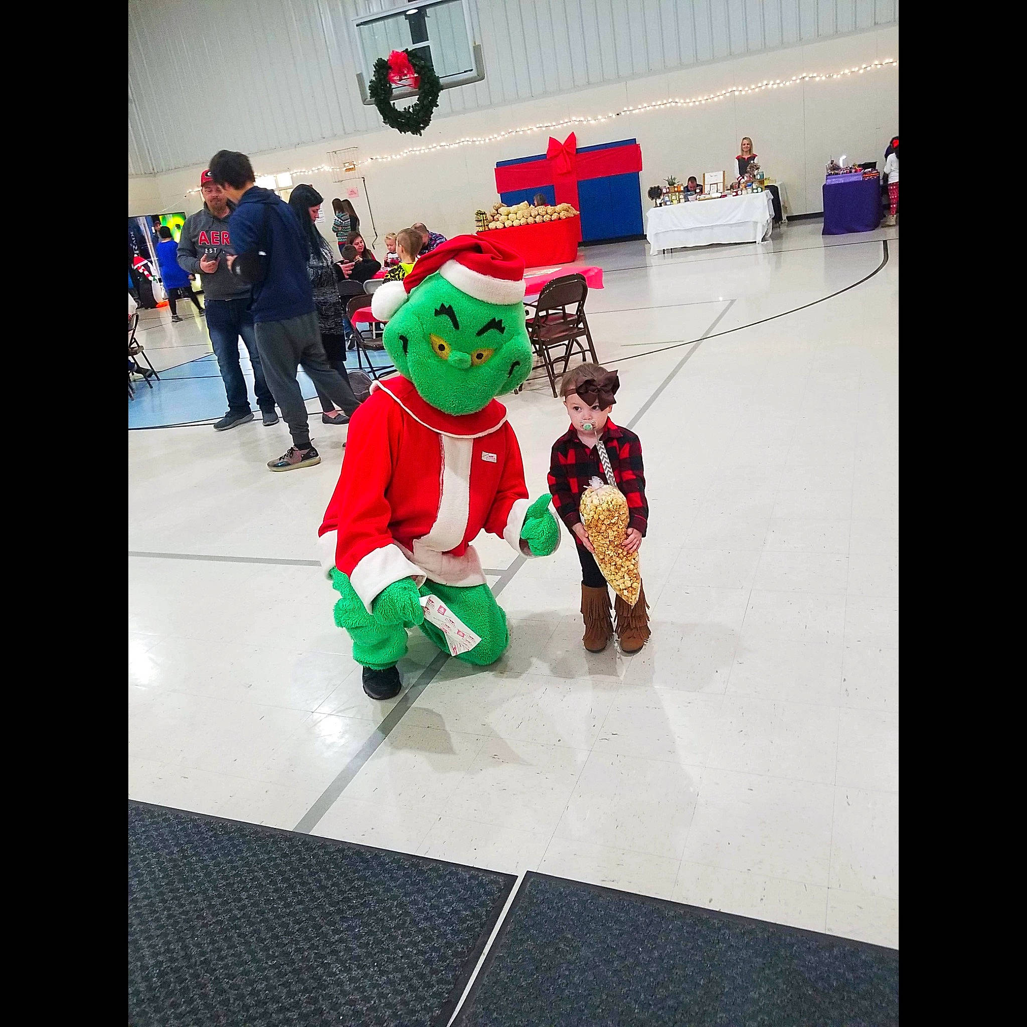 Ruby Mae is registered to the contest to win money with this photo: animation, christmas, costume, fictional_character, holiday, lego, person, santa_claus, team, toy