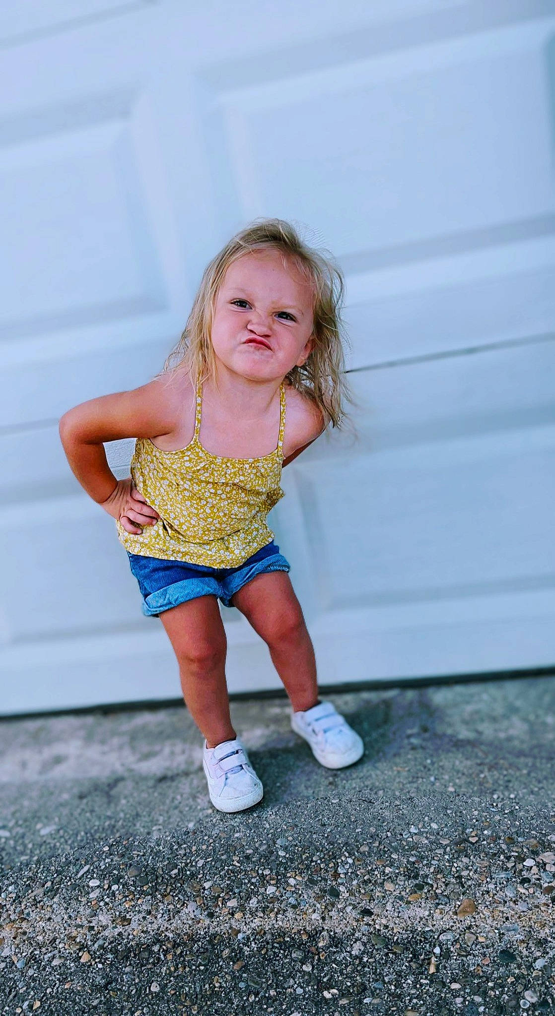Arizona is registered to the contest to win money with this photo: asphalt, baby_toddler_clothing, blond, child, electric_blue, face, flash_photography, fun, grass, happy, human_leg, knee, leisure, pattern, people_in_nature, person, recreation, sandal, sitting, thigh