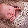 baby, blanket, closeup, cozy, cute, face, hand, infant, lace, newborn, peaceful, portrait, resting, skin, sleeping, smile, soft_texture, tender, warm, wrapped